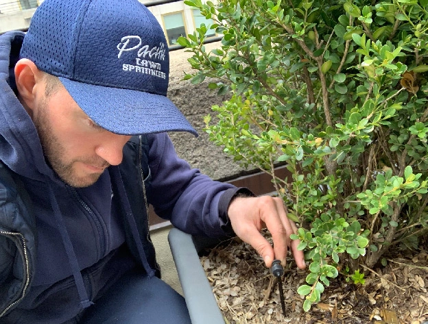 Pacific Lawn Sprinklers technician at work